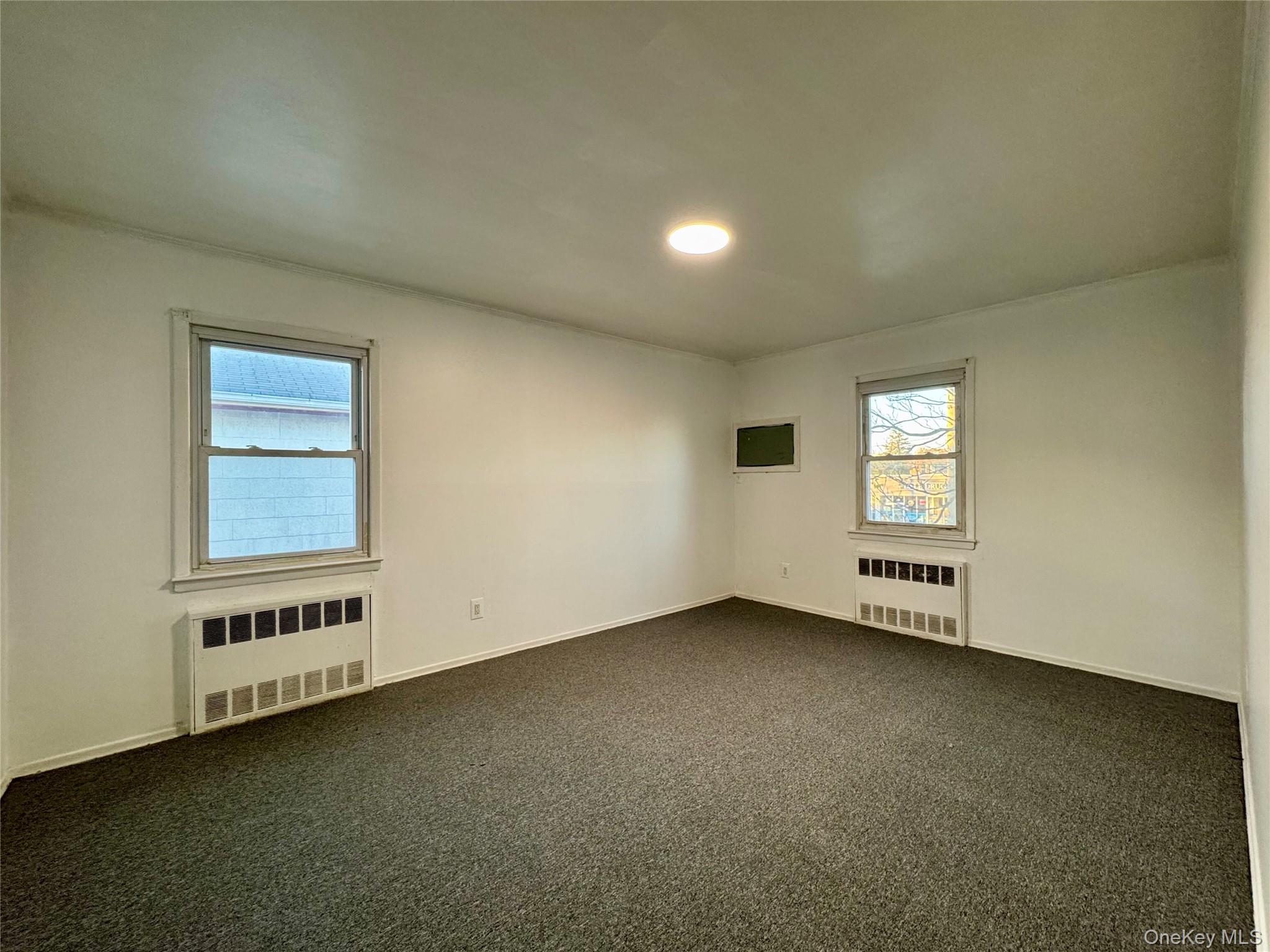 58 Cohill Road, Unit 2 Valley Stream, NY 11580 - Photo 14 of 23 an empty room with windows
