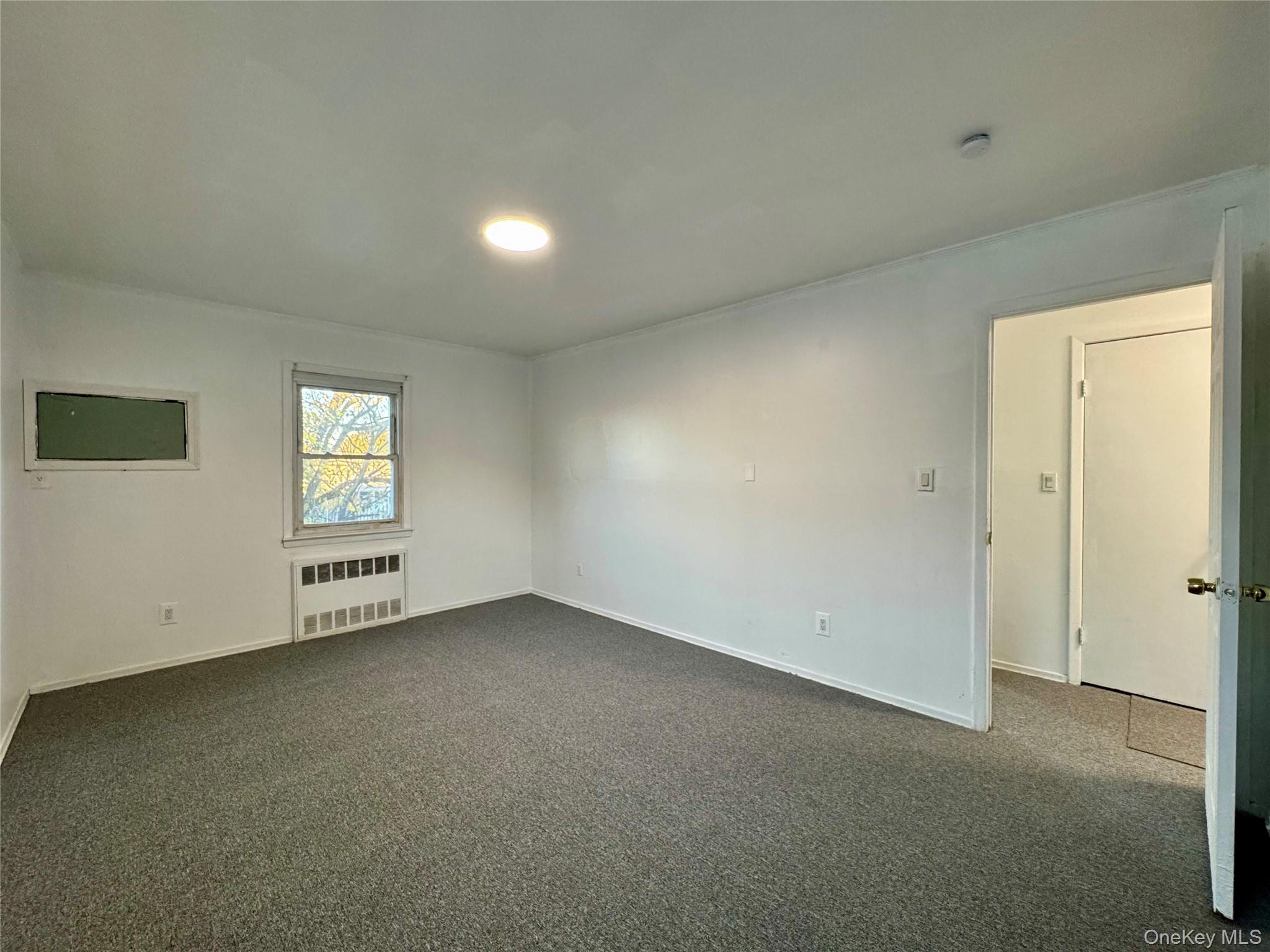 58 Cohill Road, Unit 2 Valley Stream, NY 11580 - Photo 17 of 23 a view of an empty room with a window