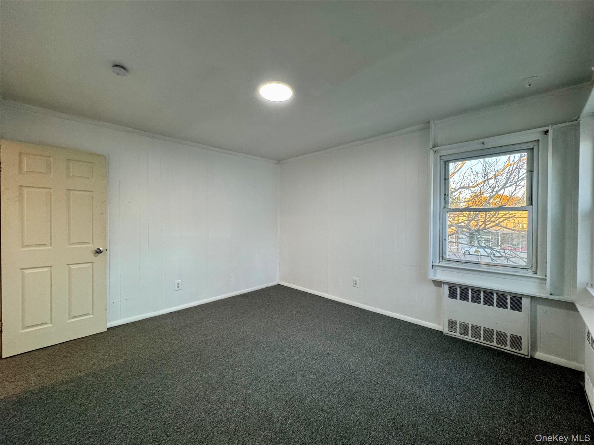 58 Cohill Road, Unit 2 Valley Stream, NY 11580 - Photo 19 of 23 an empty room with a window