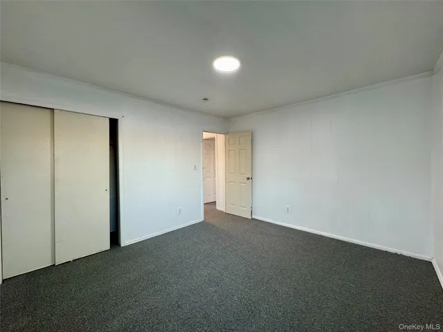 an empty room with a empty space and windows