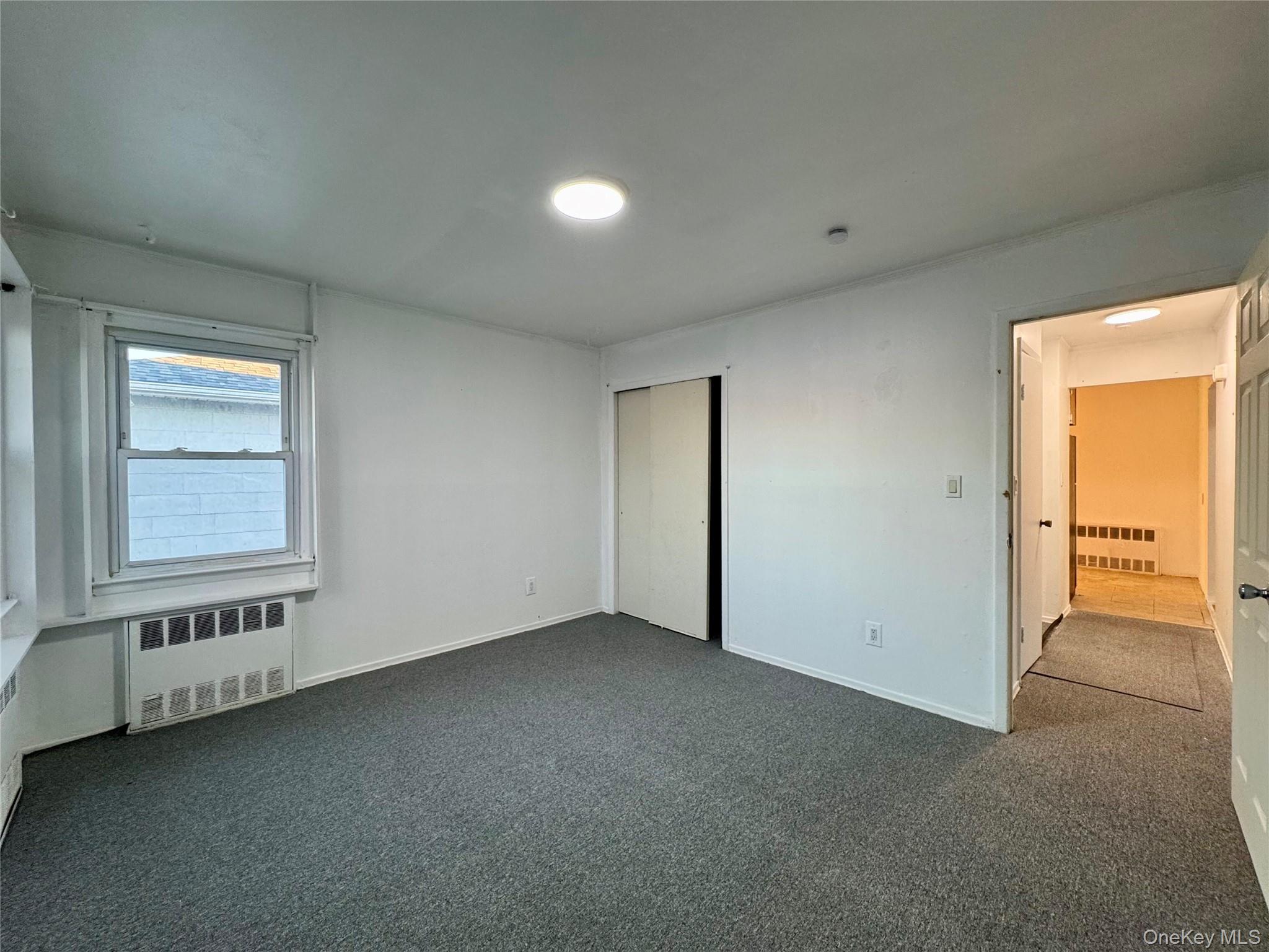 58 Cohill Road, Unit 2 Valley Stream, NY 11580 - Photo 21 of 23 an empty room with a empty space and windows