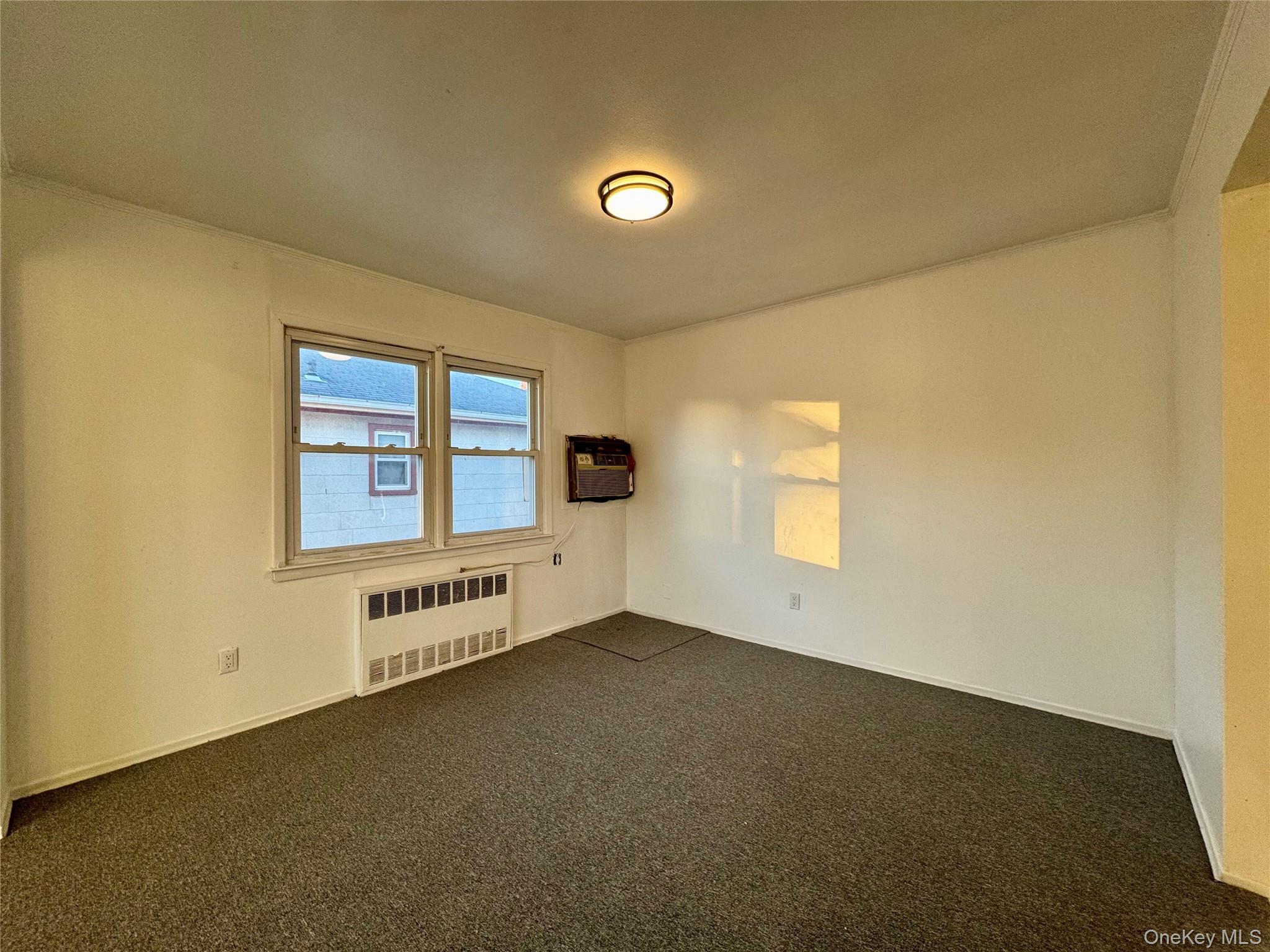 58 Cohill Road, Unit 2 Valley Stream, NY 11580 - Photo 6 of 23 an empty room with windows