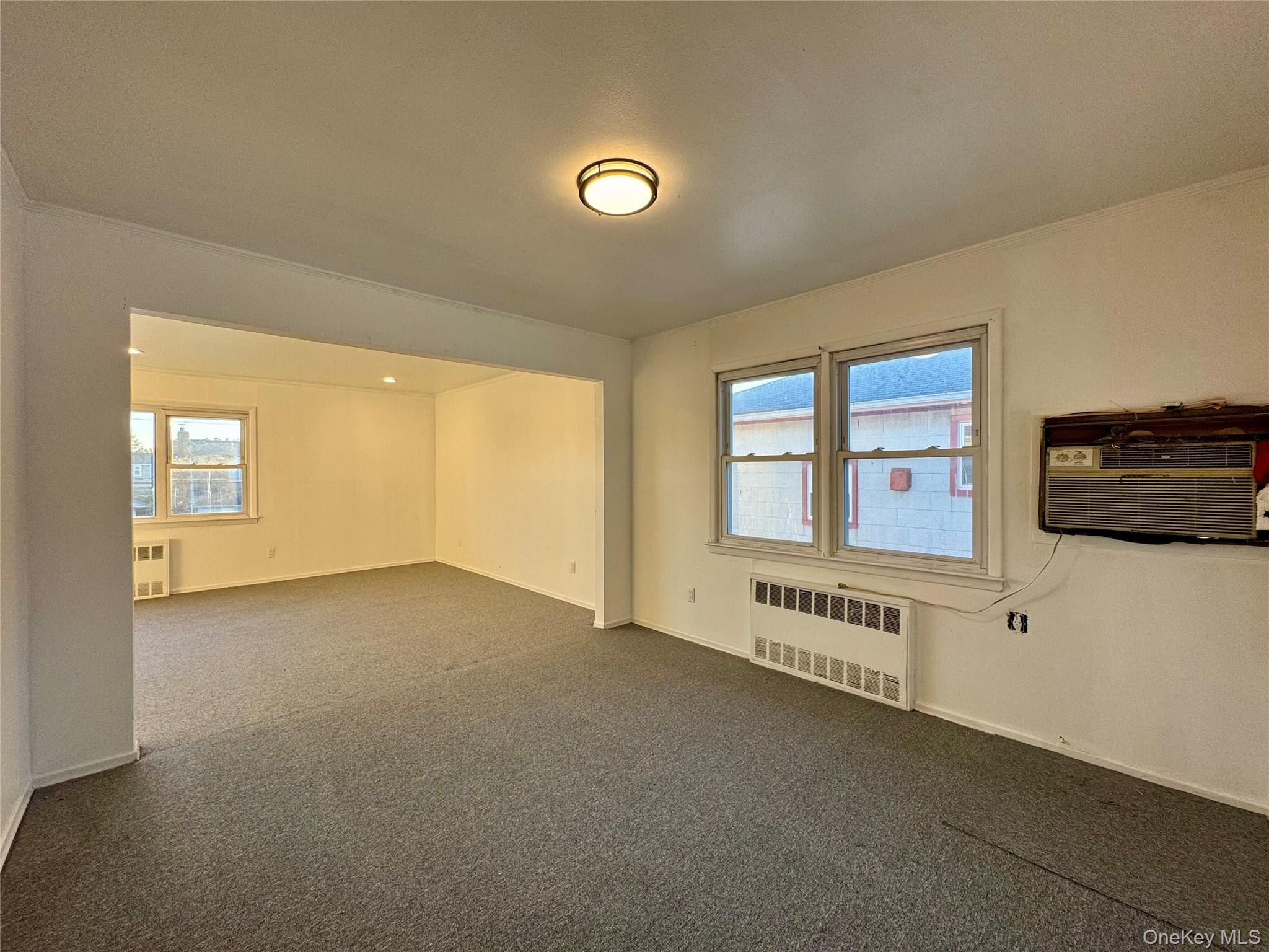 58 Cohill Road, Unit 2 Valley Stream, NY 11580 - Photo 7 of 23 a view of an empty room with a window