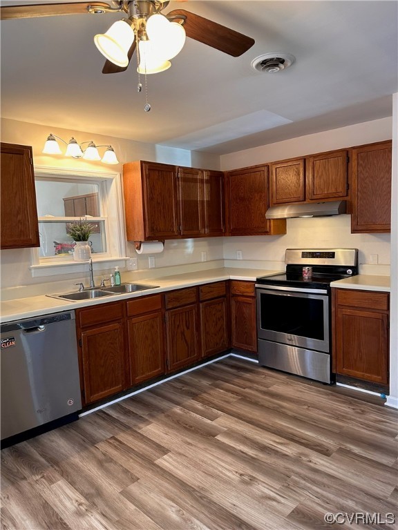 16018 Harrowgate Road Chester, VA 23831 - Photo 3 of 20 a kitchen with granite countertop stainless steel appliances and wooden cabinets