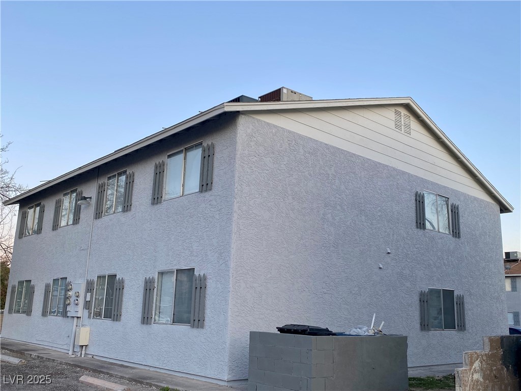 5284 Hagemann Lane, Unit D Las Vegas, NV 89110 - Photo 29 of 30 View of home's exterior featuring stucco siding