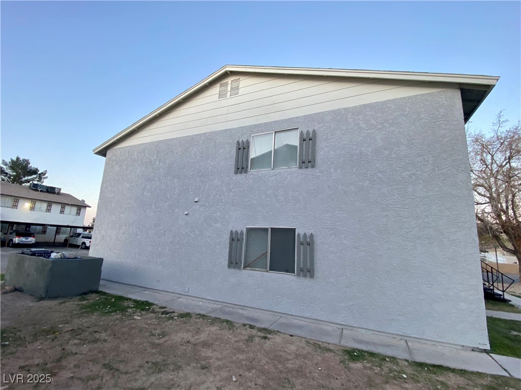 5284 Hagemann Lane, Unit D Las Vegas, NV 89110 - Photo 30 of 30 View of property exterior with stucco siding