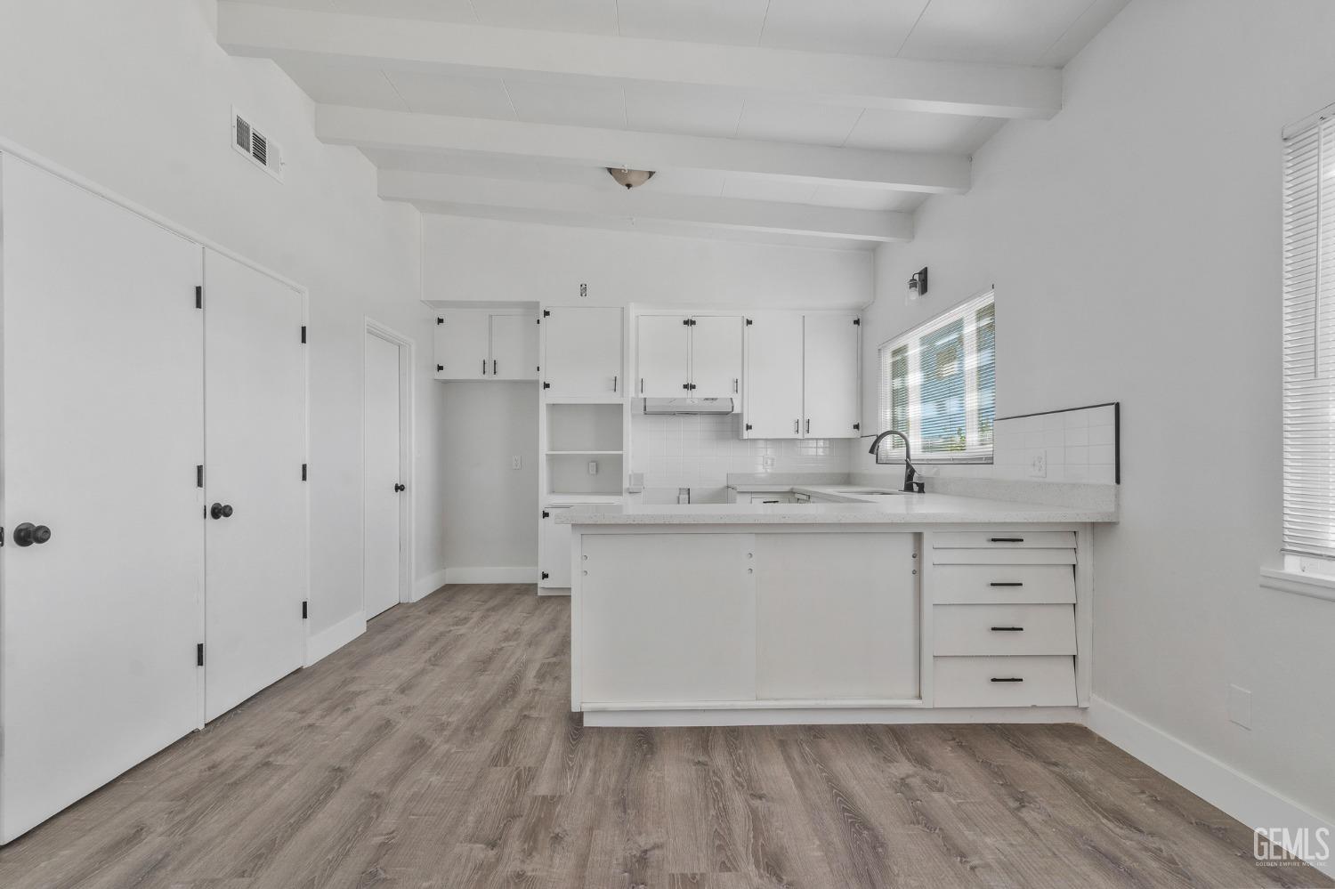 Undisclosed Address Bakersfield, CA 93305 - Photo 17 of 23 a bathroom with a granite countertop sink and a mirror