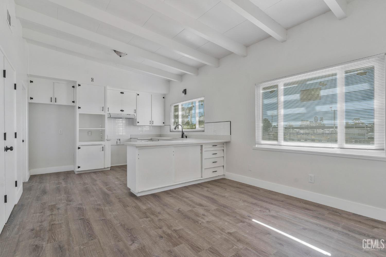 Undisclosed Address Bakersfield, CA 93305 - Photo 18 of 23 a kitchen with a white wooden cabinets and window