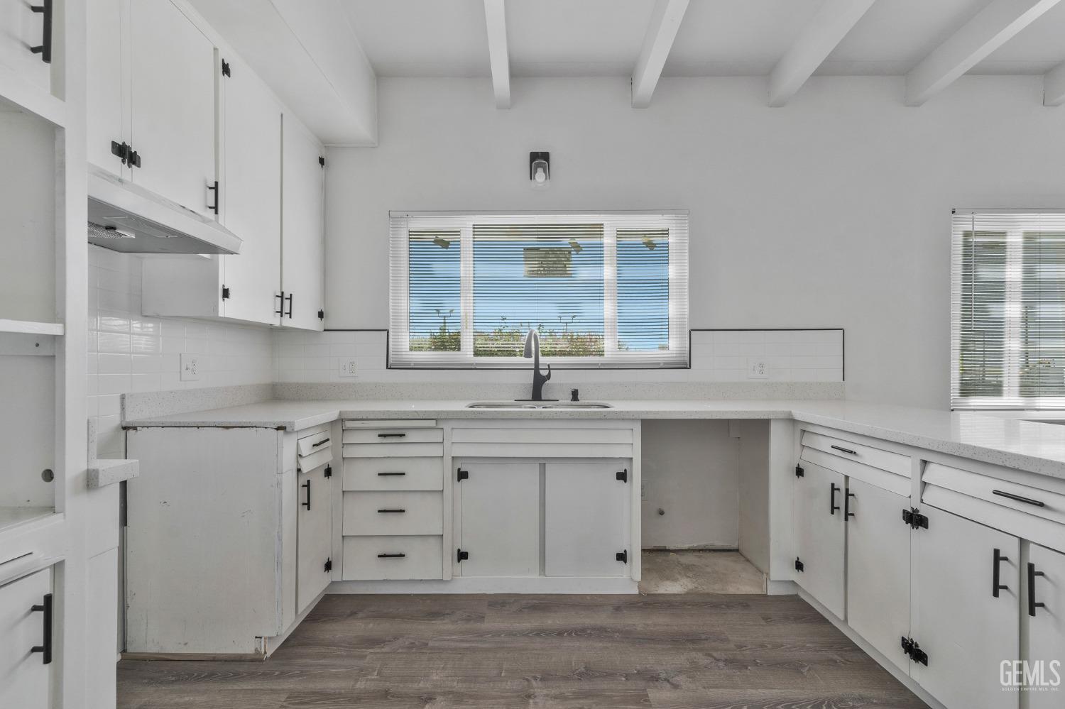Undisclosed Address Bakersfield, CA 93305 - Photo 19 of 23 a kitchen with stainless steel appliances granite countertop a sink and a stove next to a window
