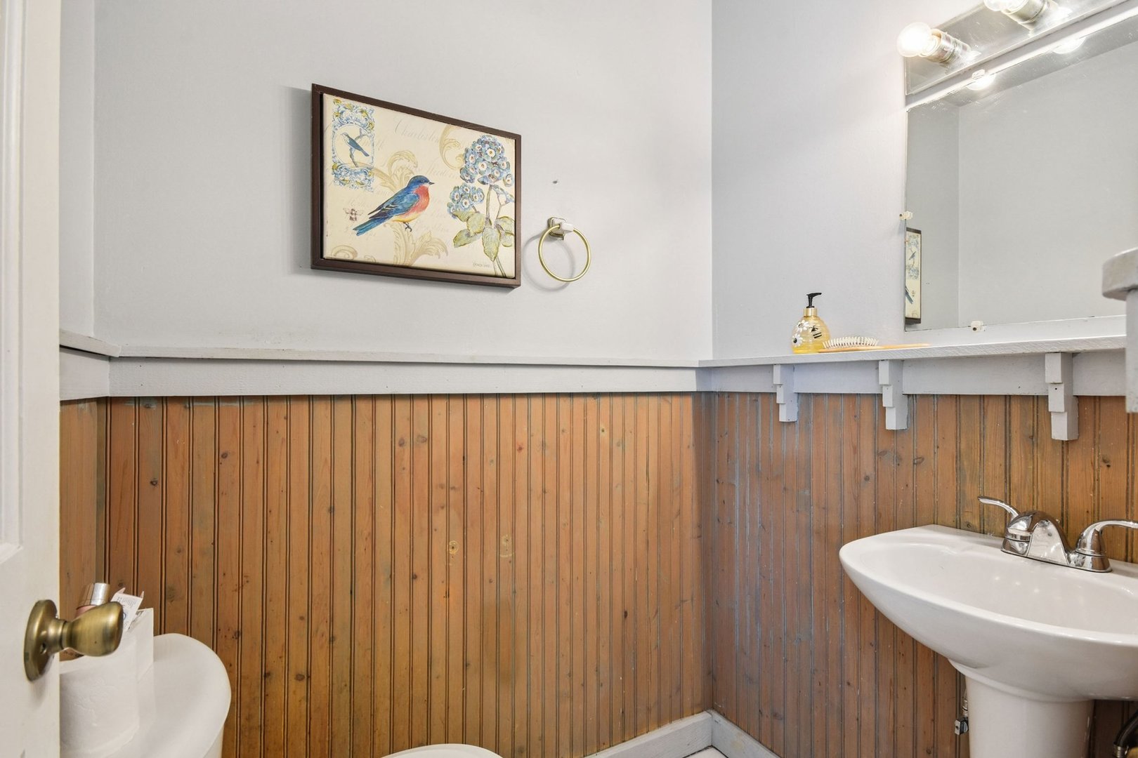 828 Lavergne Avenue Wilmette, IL 60091 - Photo 8 of 19 a bathroom with a sink and a mirror