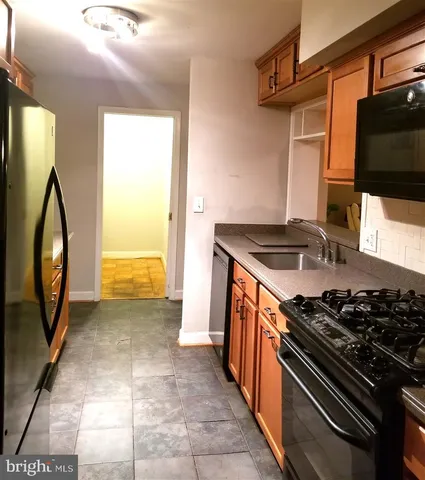 a kitchen with a stove and a microwave