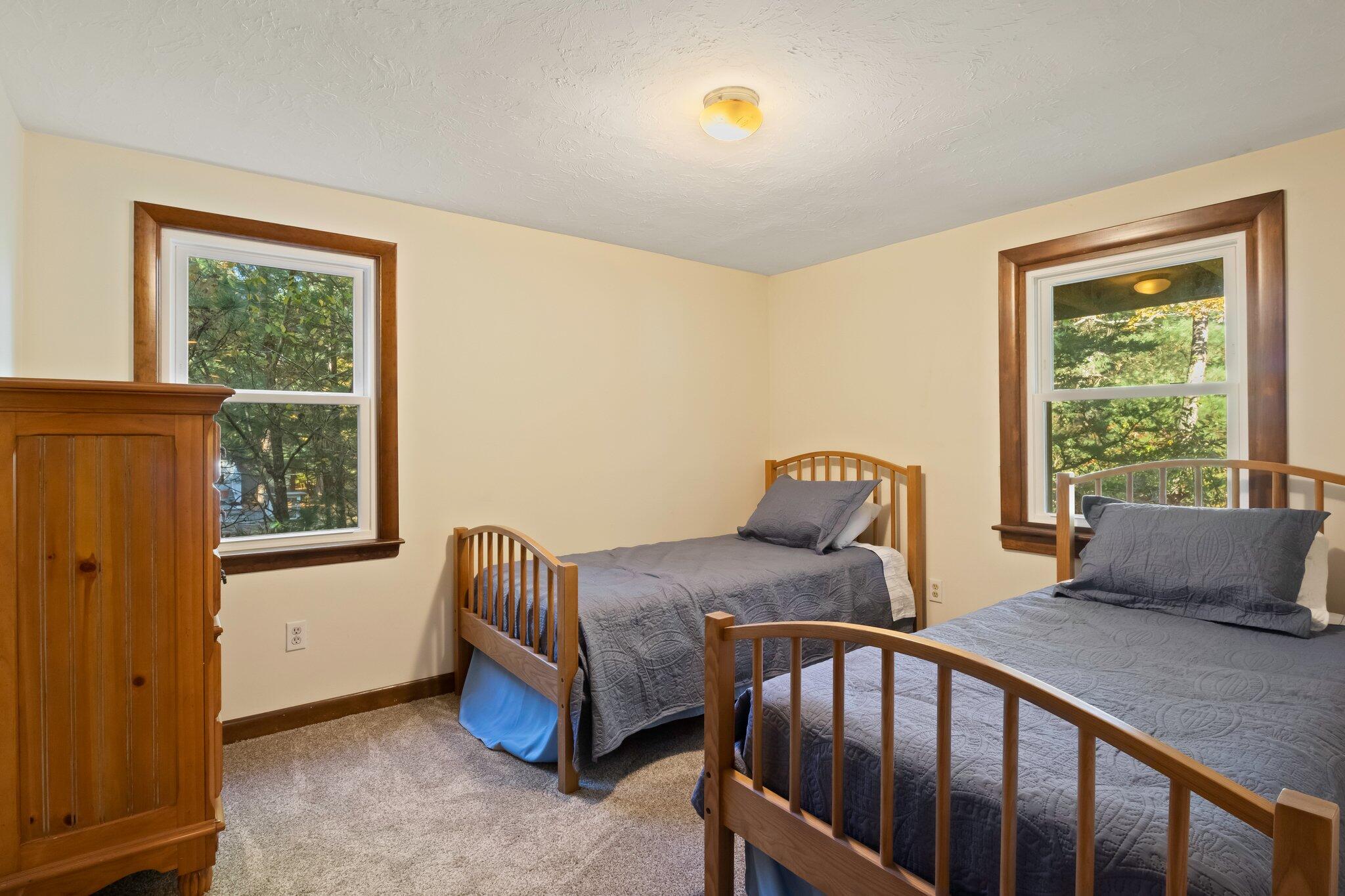 270 Mashpee Neck Road Mashpee, MA 02649 - Photo 15 of 36 a bedroom with furniture and windows