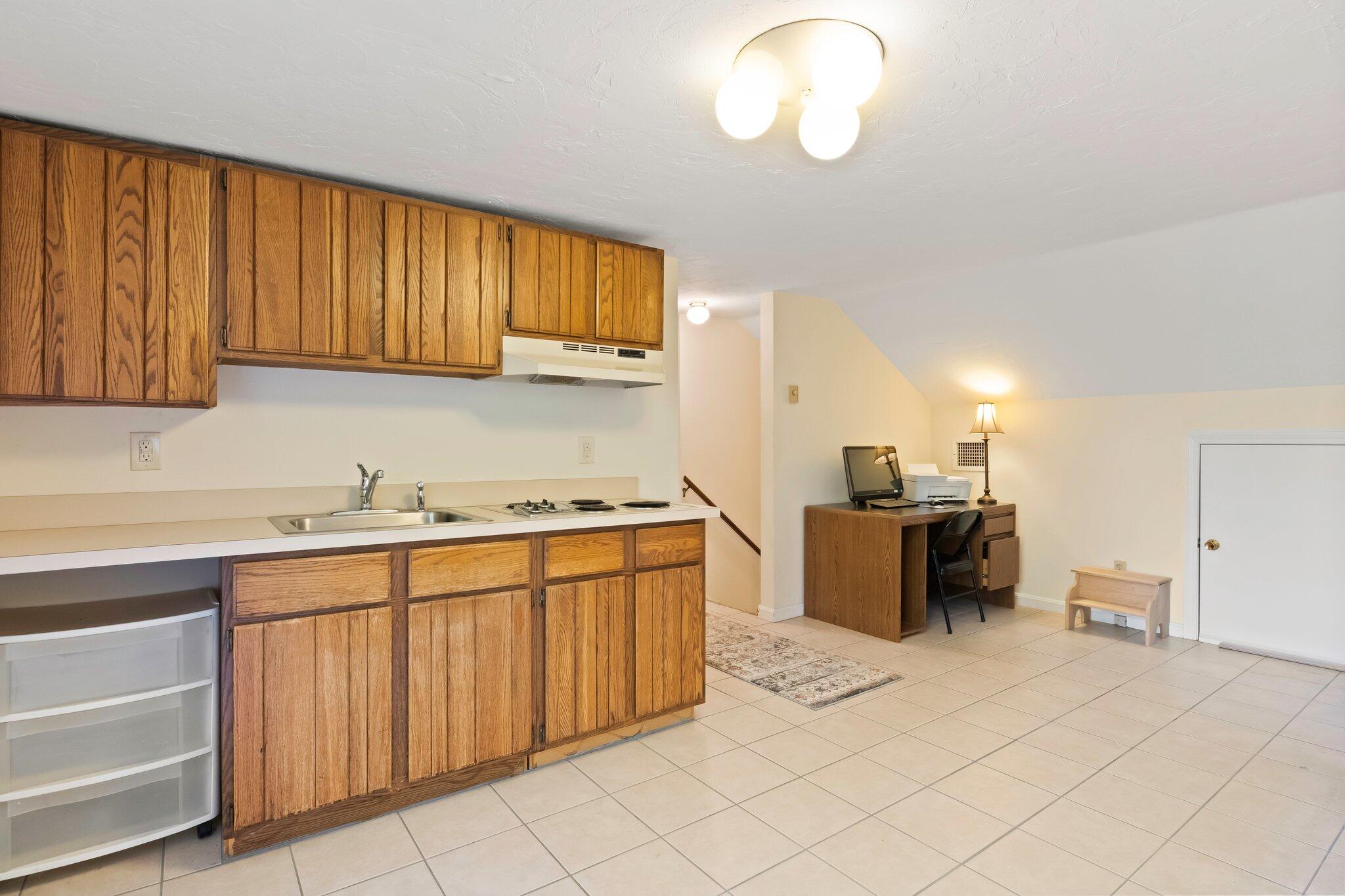 270 Mashpee Neck Road Mashpee, MA 02649 - Photo 20 of 36 a kitchen with stainless steel appliances granite countertop a sink and cabinets