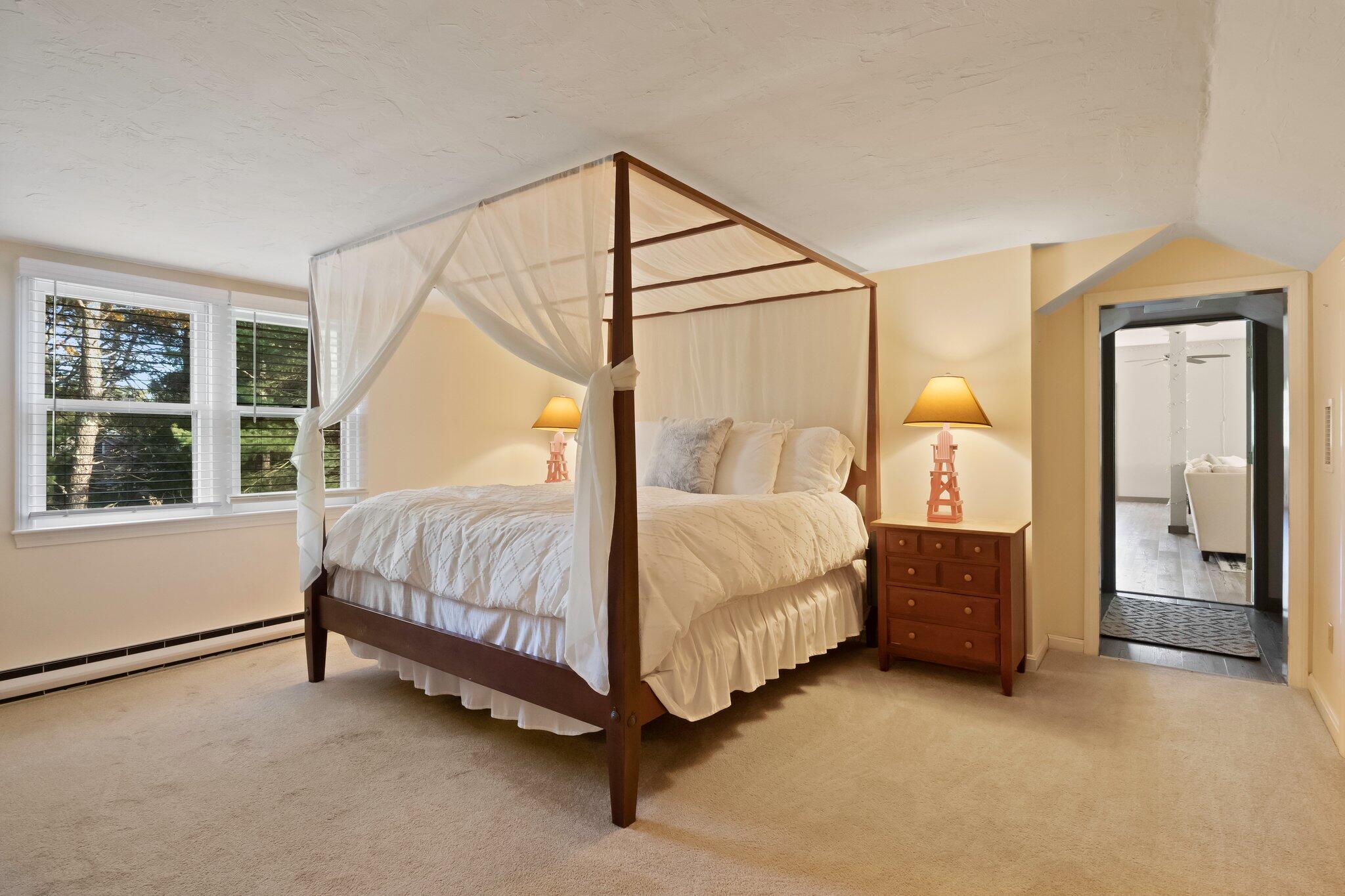 270 Mashpee Neck Road Mashpee, MA 02649 - Photo 21 of 36 a spacious bedroom with a bed and a window