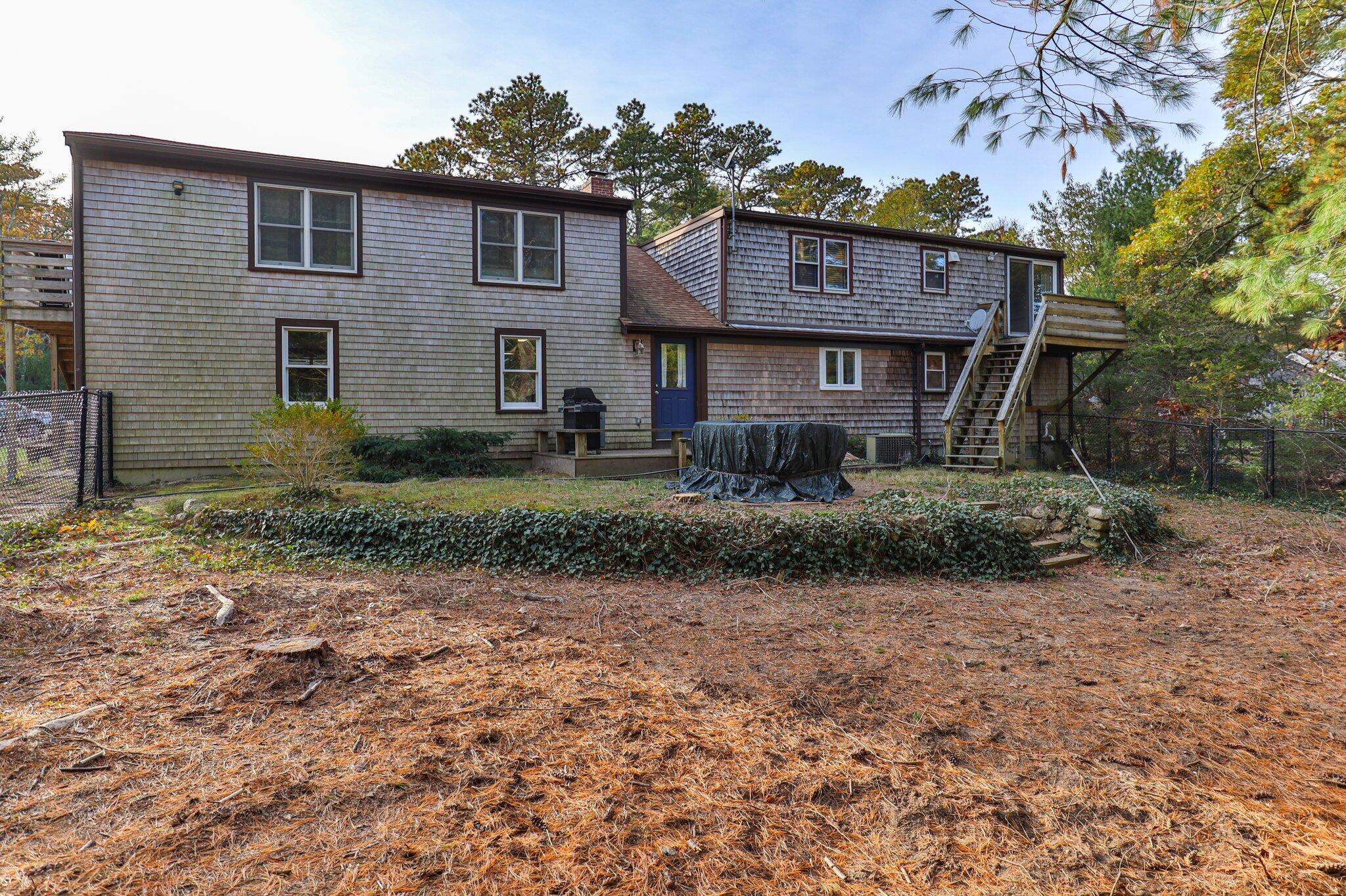 270 Mashpee Neck Road Mashpee, MA 02649 - Photo 24 of 36 a front view of a house with garden
