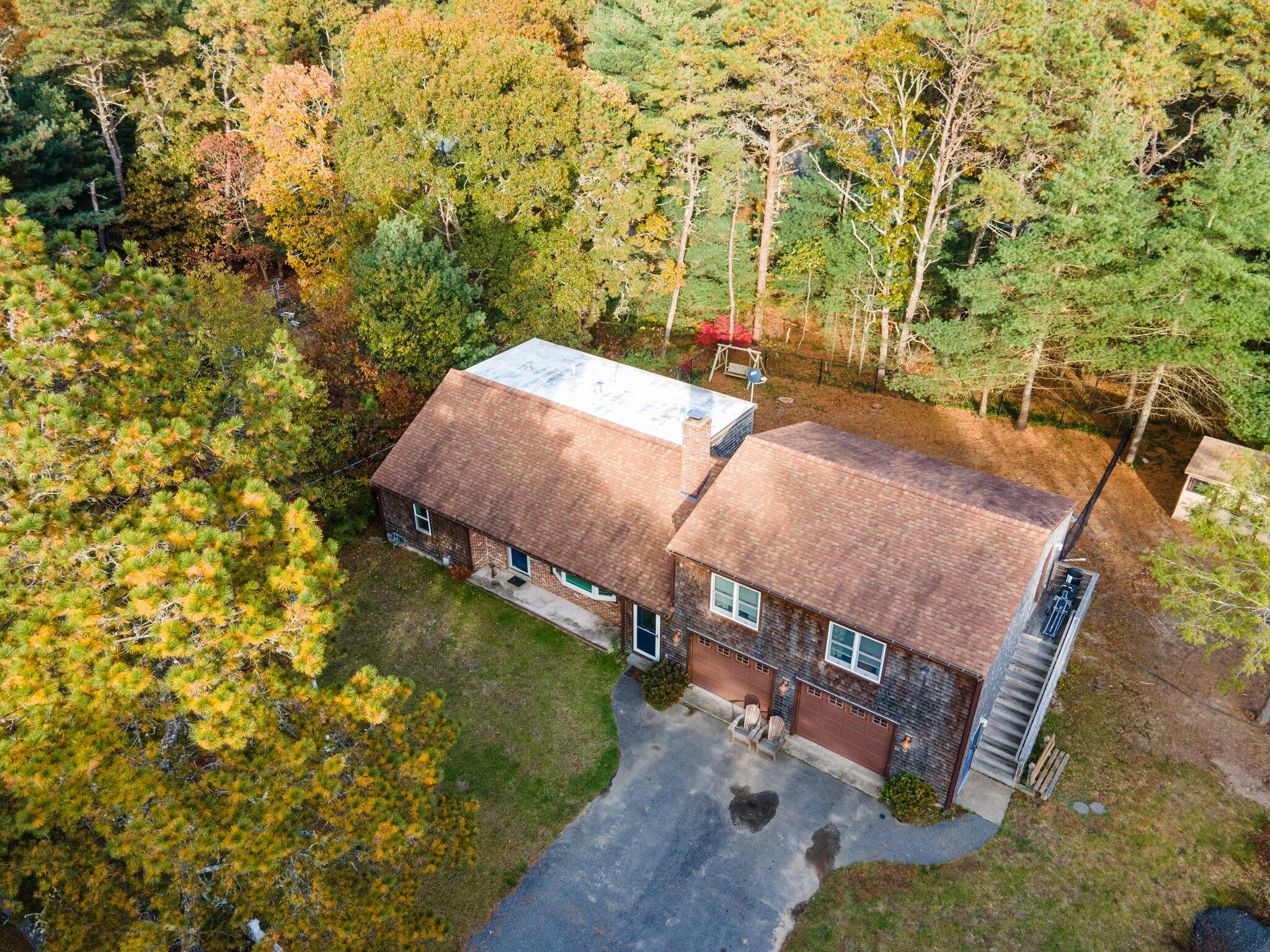 270 Mashpee Neck Road Mashpee, MA 02649 - Photo 25 of 36 a view of a backyard with swimming pool