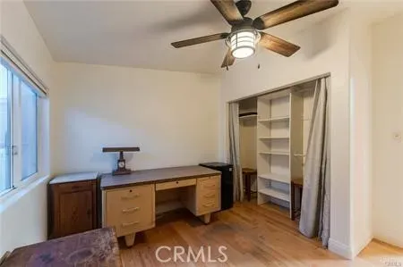 a bedroom with a large bed and a large window