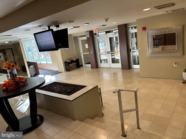 a view of kitchen with furniture and flat screen tv