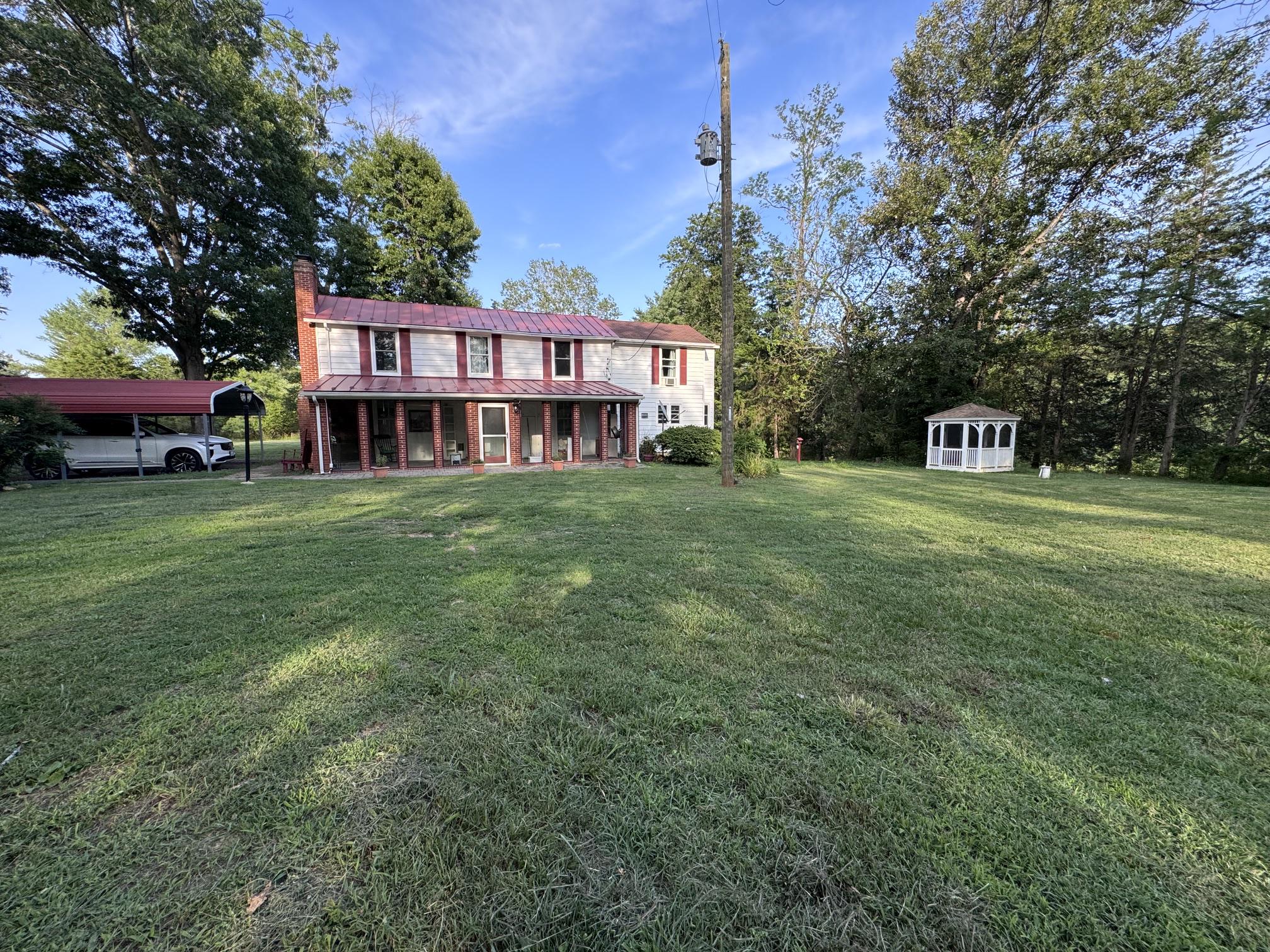 31934 Indiantown Road Locust Grove, VA 22508 - Photo 3 of 6 a view of a house with a big yard
