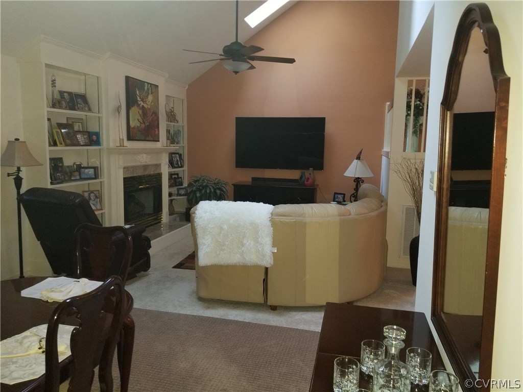 405 Rivers Bend Circle Chester, VA 23836 - Photo 10 of 33 Living room has a 75" TV and built in bookcases