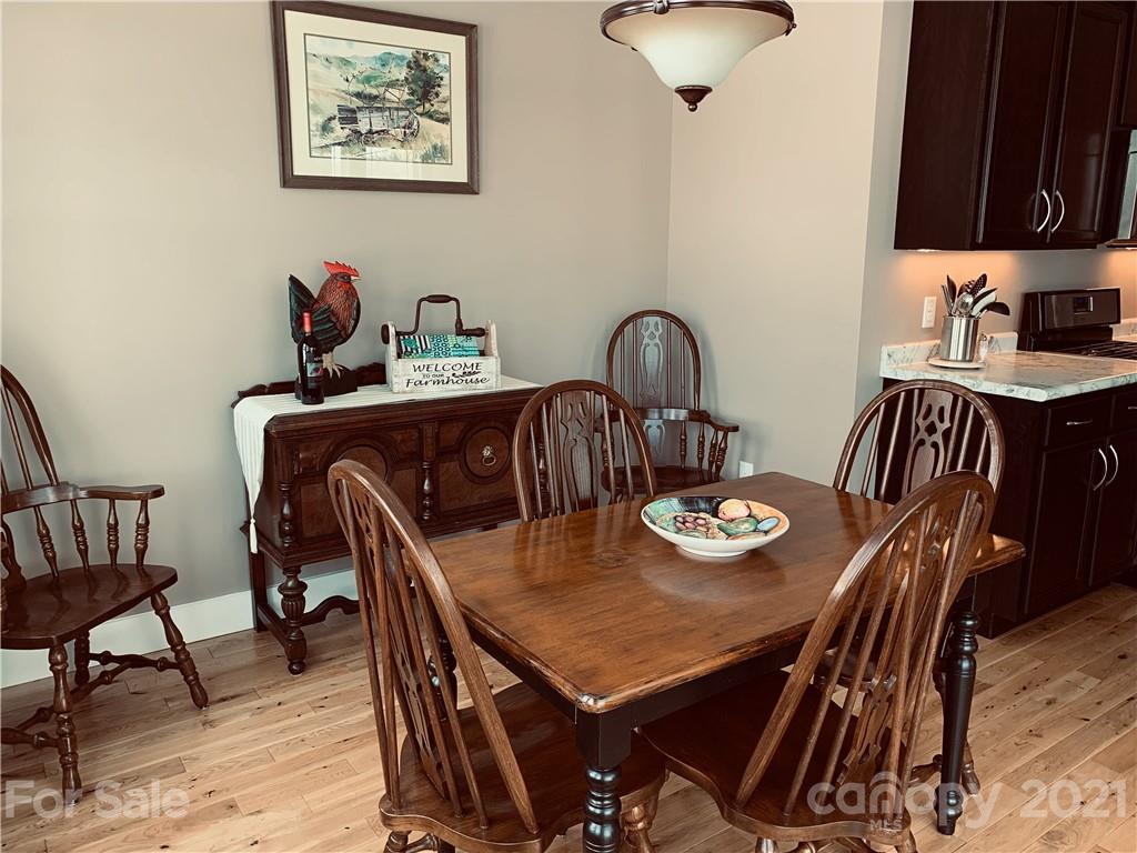 605 Souther Road Fletcher, NC 28732 - Photo 14 of 31 a view of a dining room with furniture and wooden floor