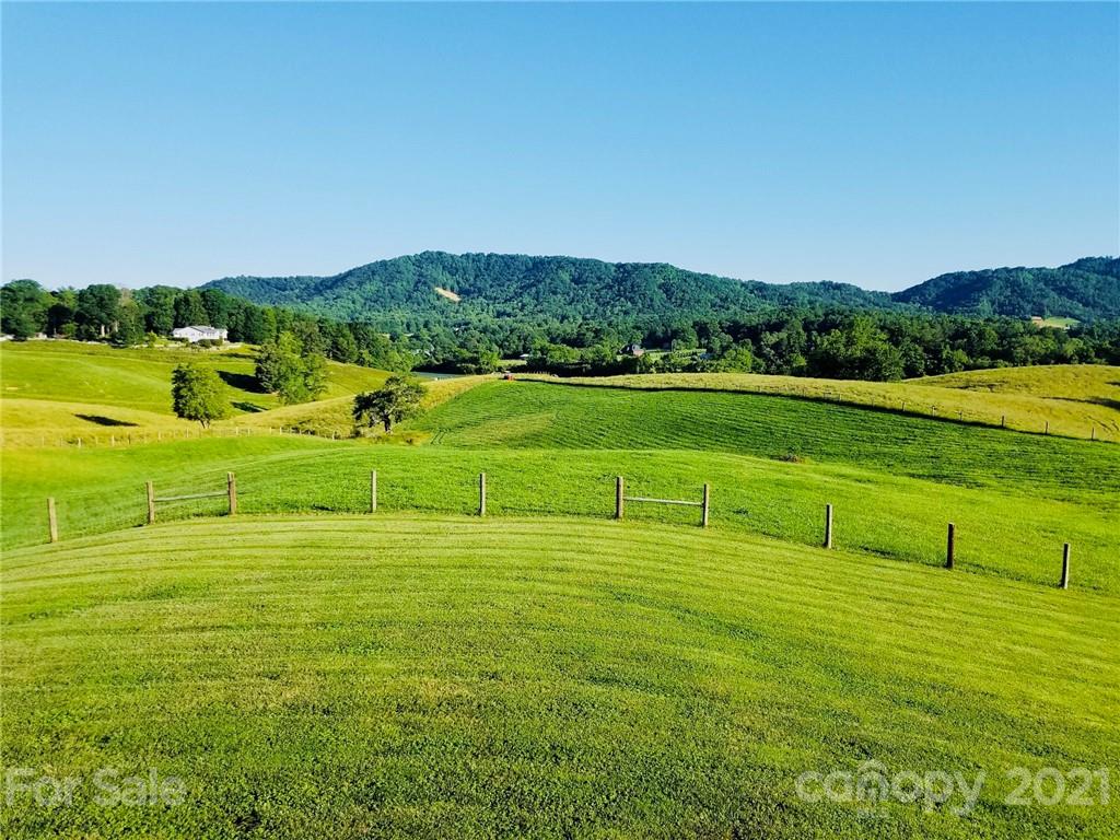 605 Souther Road Fletcher, NC 28732 - Photo 21 of 31 a view of a golf course with a lake