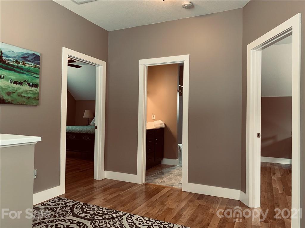 605 Souther Road Fletcher, NC 28732 - Photo 24 of 31 a view of a hallway with wooden floor and closet