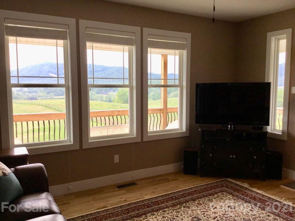 605 Souther Road Fletcher, NC 28732 - Photo 5 of 31 a living room with furniture and a flat screen tv