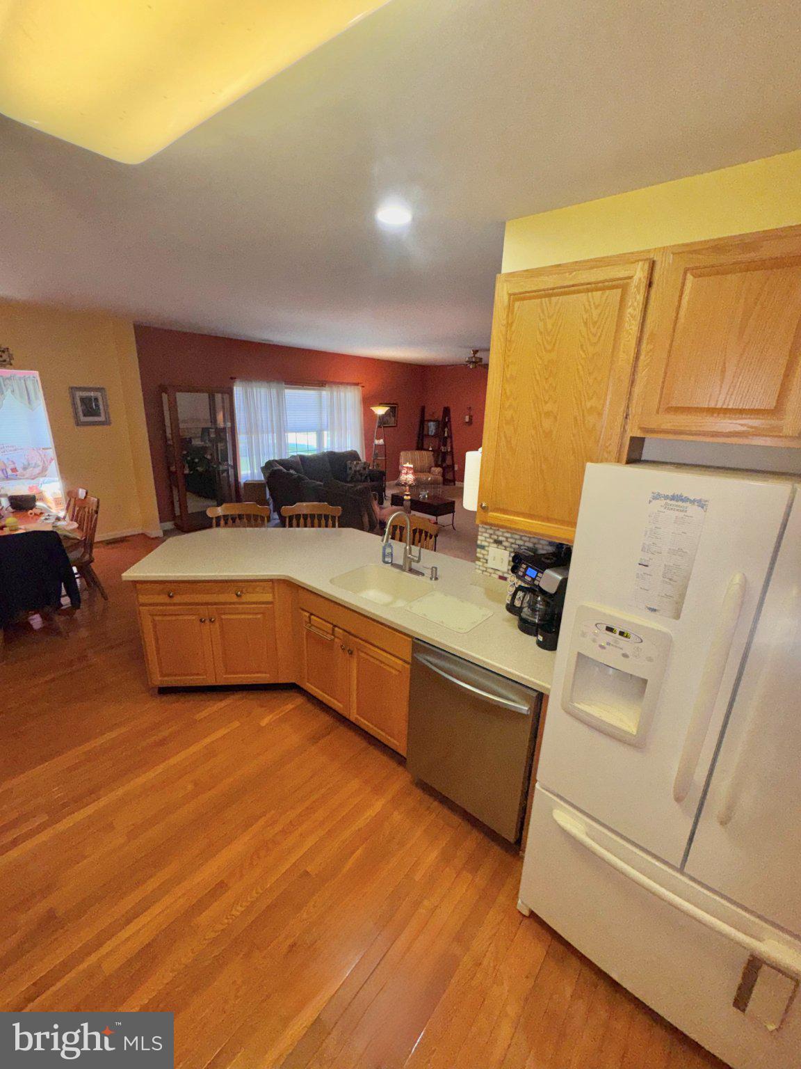 231 Foxglove Loop Bear, DE 19701 - Photo 11 of 30 a kitchen with stainless steel appliances a stove a sink and a refrigerator