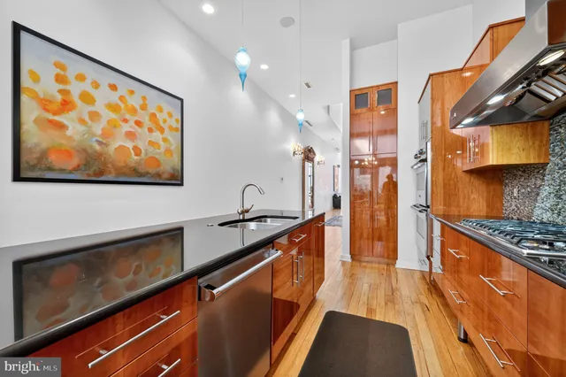 a dining room with furniture and a chandelier