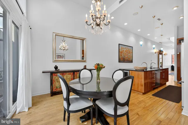 a dining room with furniture and wooden floor