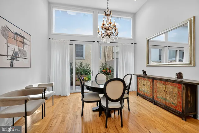 a view of a house with a yard and flowers in front of main door