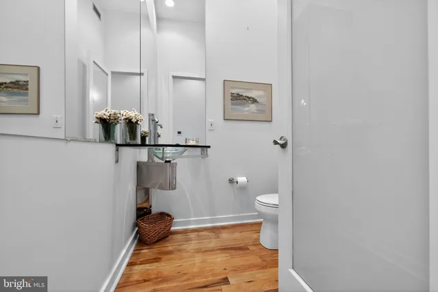 a living room with furniture rug and a floor to ceiling window