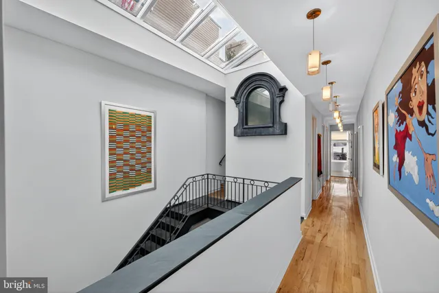 a bedroom with a bed window and a flat screen tv
