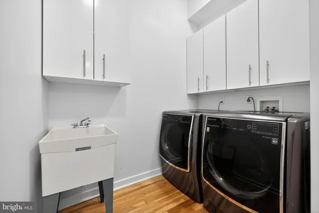 a bathroom with a granite countertop toilet sink and mirror