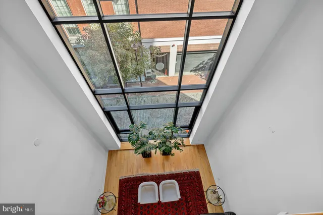 a kitchen with stainless steel appliances granite countertop a sink a stove and a wooden cabinets