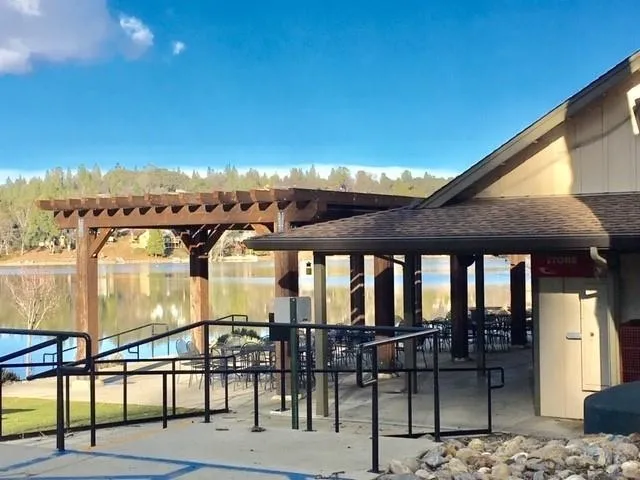 a view of a patio with table and chairs