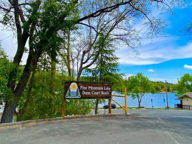 a sign that is on the side of the tree