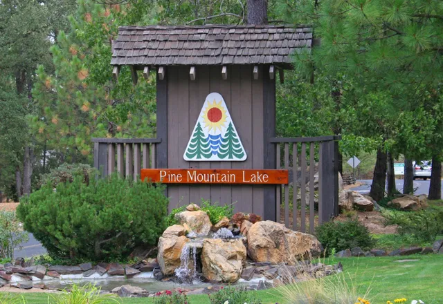 a view of a patio with furniture and garden