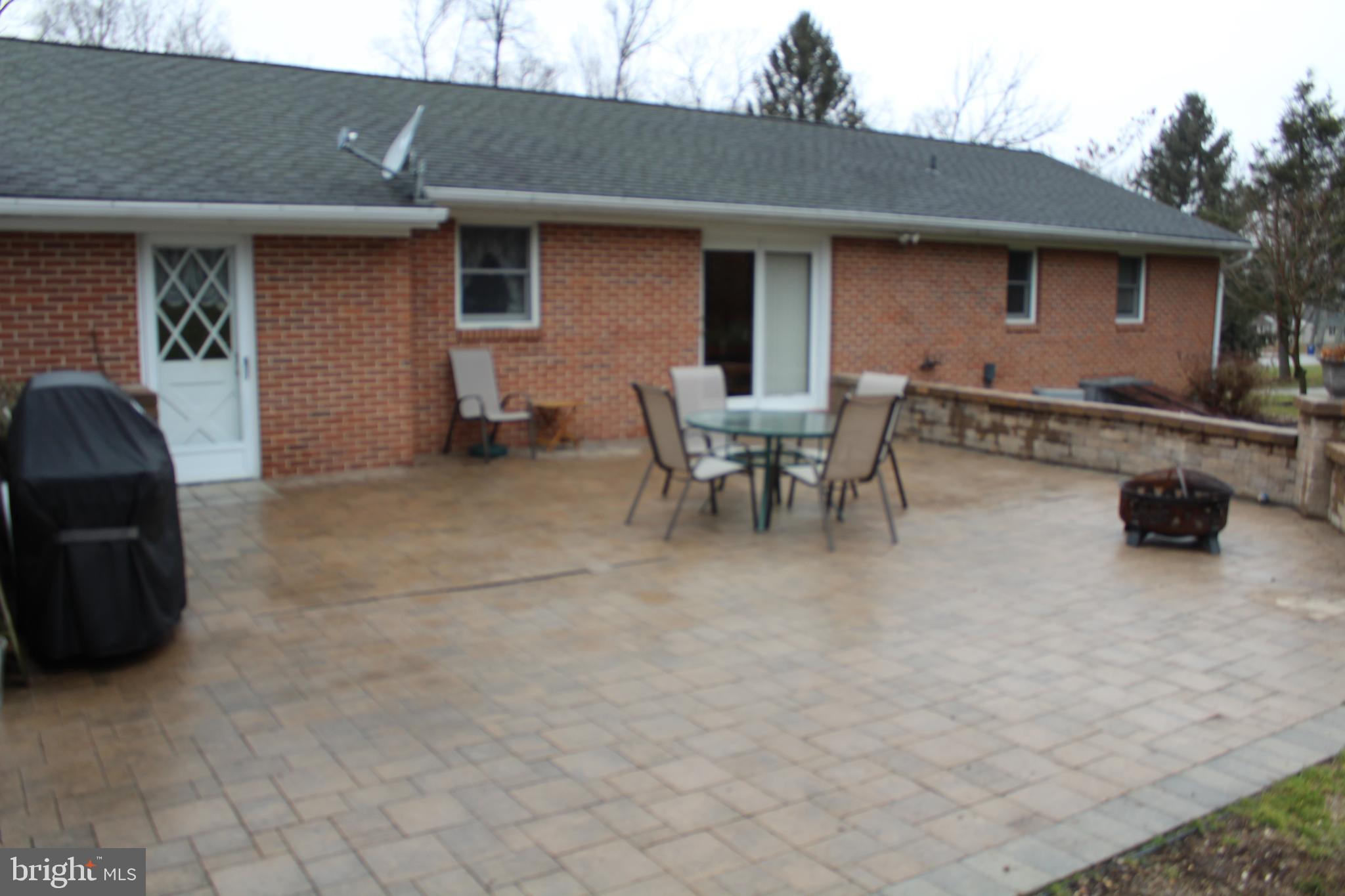 1037 Bollinger Road Littlestown, PA 17340 - Photo 54 of 56 a backyard of a house with barbeque oven and outdoor seating