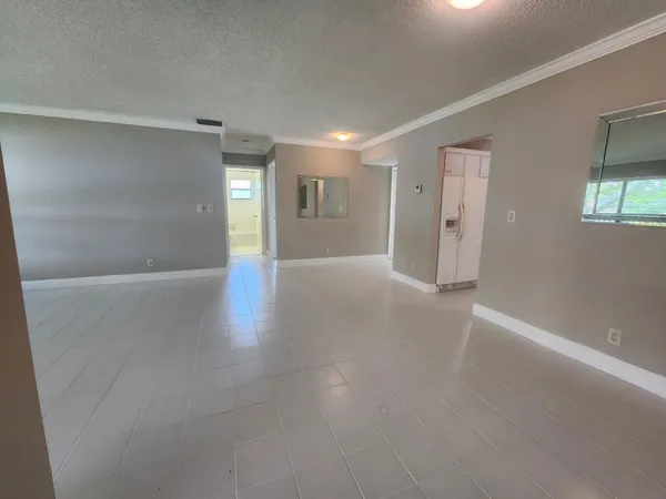 a kitchen with stainless steel appliances a refrigerator sink and cabinets