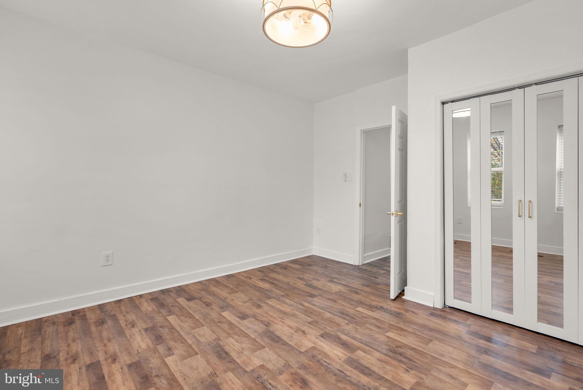 74 O Street Northwest Washington, DC 20001 - Photo 15 of 24 a view of a room with wooden floor and sliding glass door