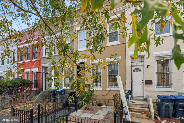 a view of an empty room and a window