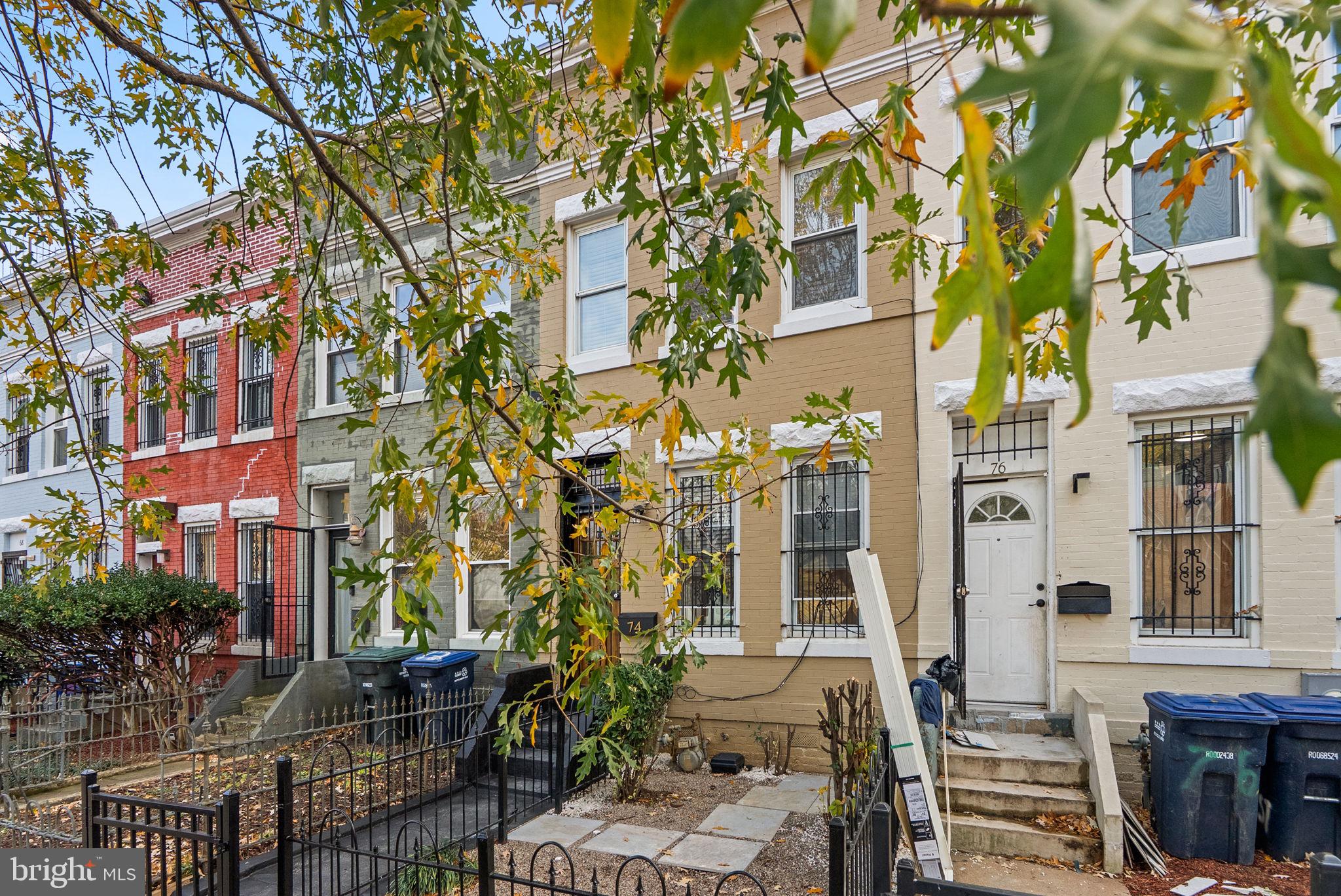 74 O Street Northwest Washington, DC 20001 - Photo 3 of 24 a front view of a multi story building with yard