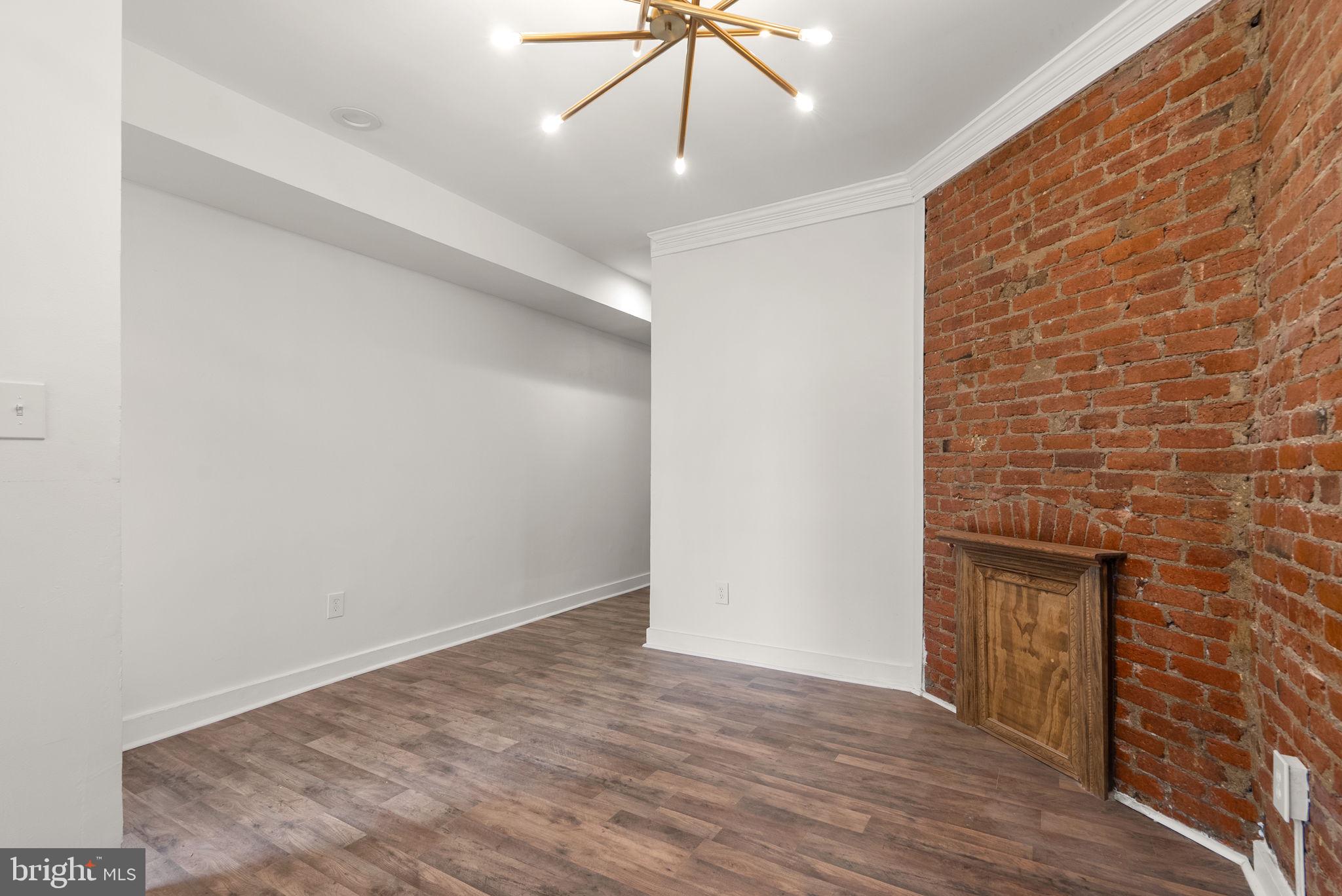 74 O Street Northwest Washington, DC 20001 - Photo 6 of 24 a view of an empty room with wooden floor