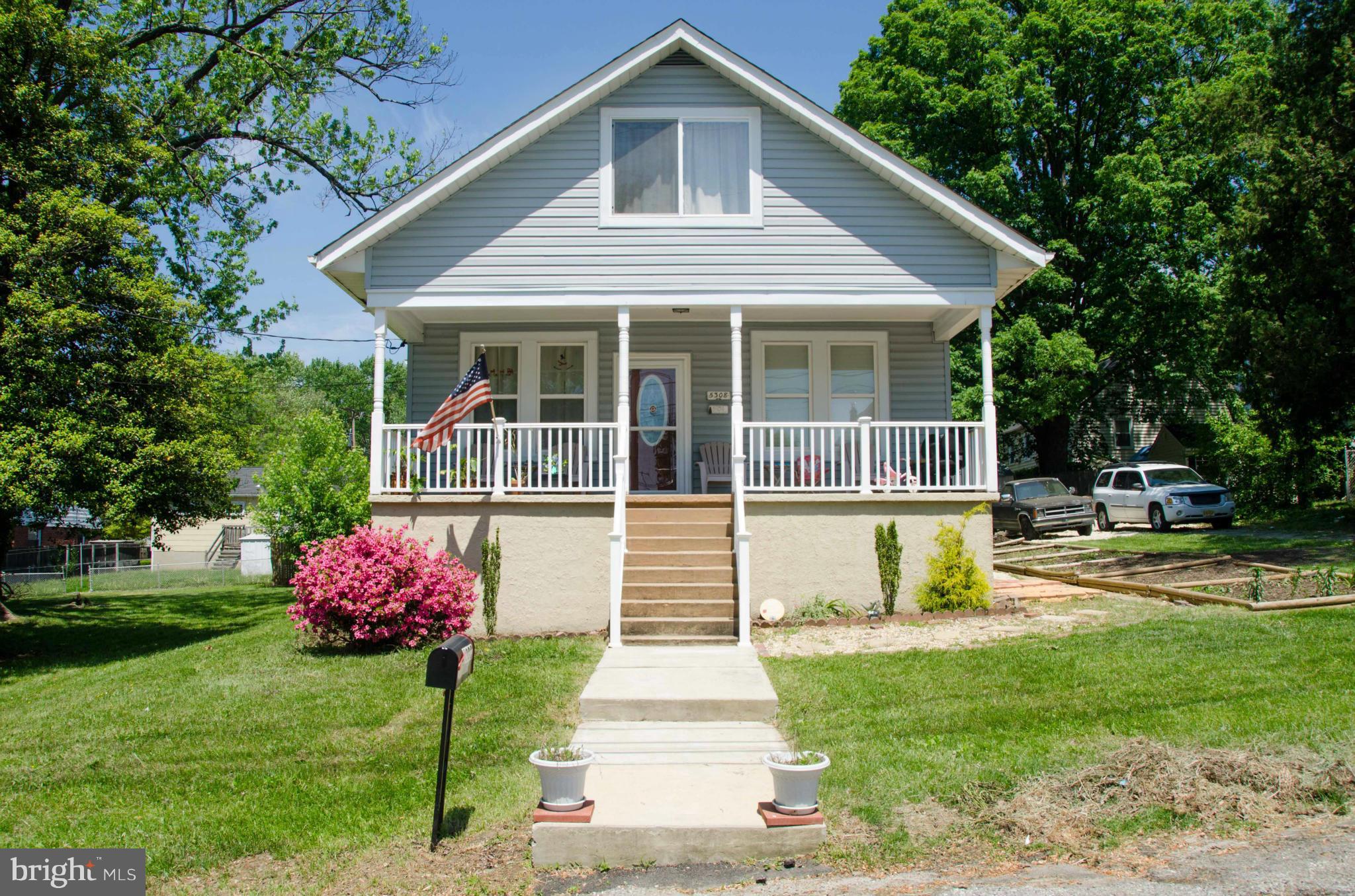 5308 Overhill Road Baltimore, MD 21207 - Photo 2 of 16 a front view of a house with a yard