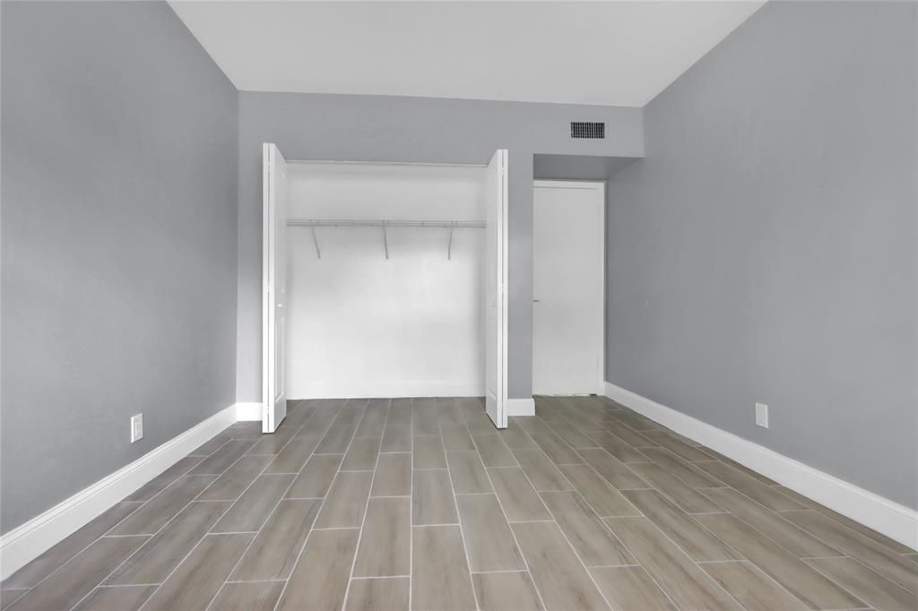 260 Northwest 19th Street, Unit 1 Boca Raton, FL 33432 - Photo 13 of 14 a view of an empty room with wooden floor