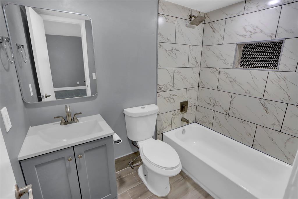 260 Northwest 19th Street, Unit 1 Boca Raton, FL 33432 - Photo 5 of 14 a bathroom with a sink toilet and shower