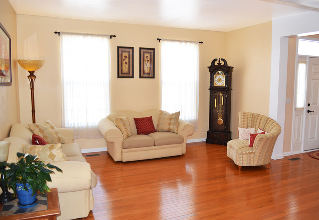 1219 Mariemont Road Sugar Grove, IL 60554 - Photo 4 of 25 a living room with furniture and a wooden floor