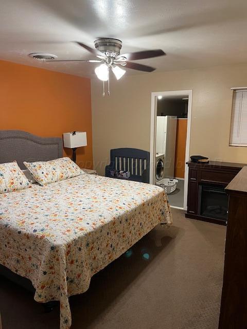 622 North 14th Street Memphis, TX 79245 - Photo 13 of 29 a bed sitting in a bedroom next to a lamp